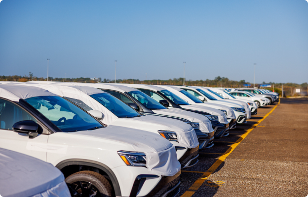 A line of cars parked in a lot