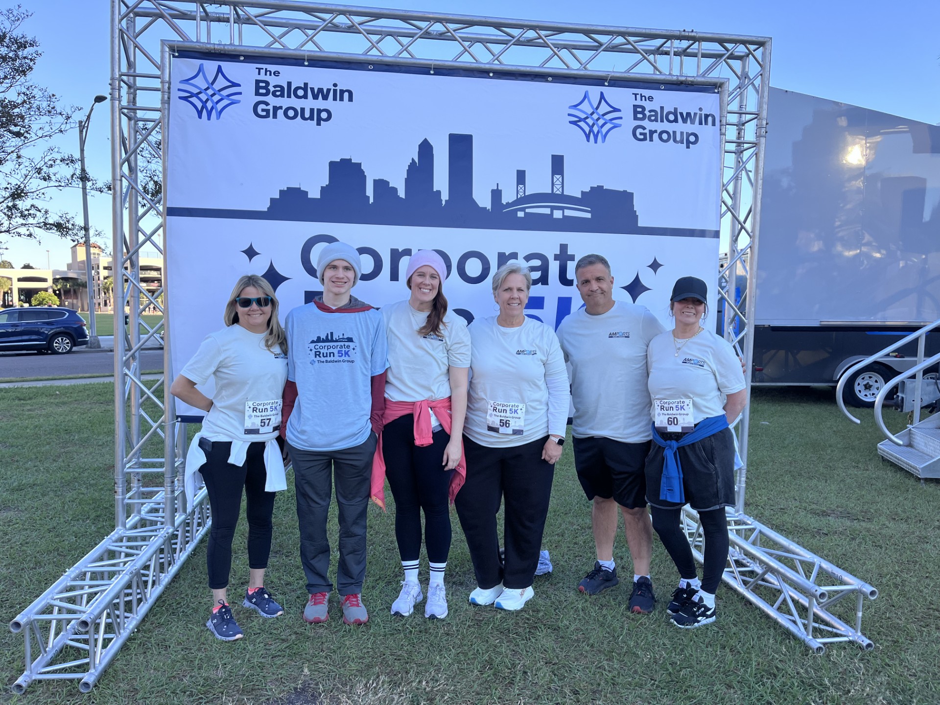 A group portrait of Amports team wearing a sport attire