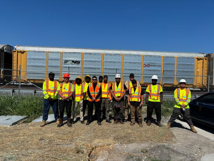 A group portrait of Amports' Wylie Rail team