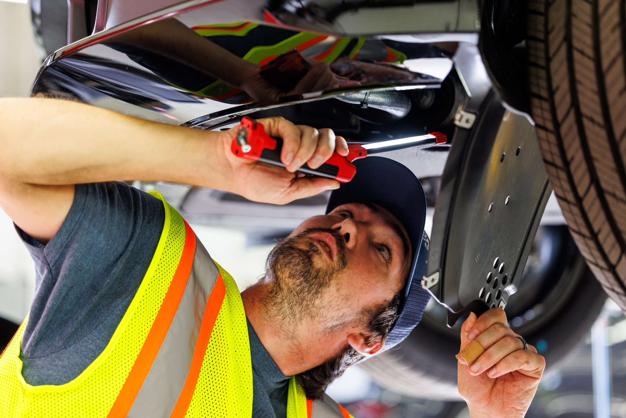 Amports mechanic working under the car